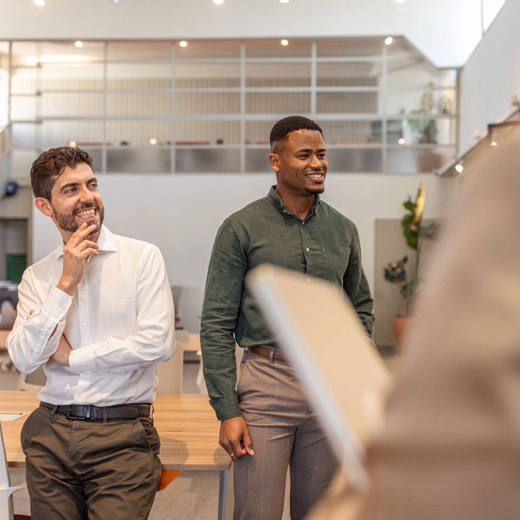 Colleagues in modern office representing private equity and real assets team